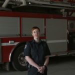 person standing infront of firetruck