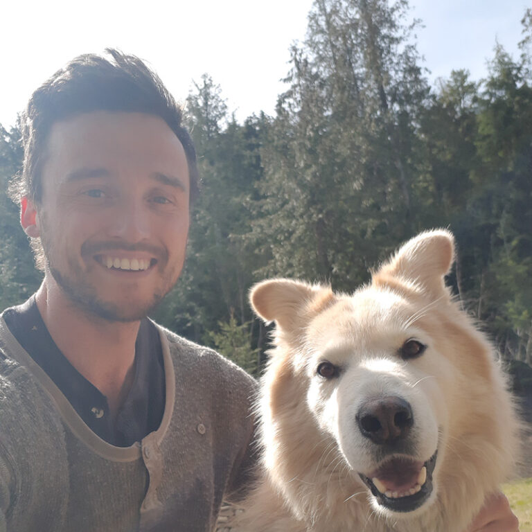 Man smiling with a dog