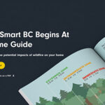 An open guidebook with a diagram and text saying "FireSmart BC Begins At Home Guide" is shown against a dark background