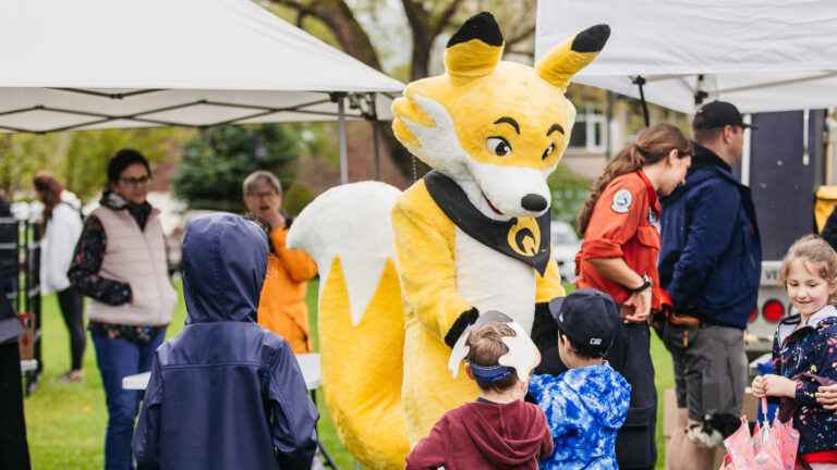 Firesmart mascot talking to kids